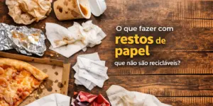 Mesa com resíduos de papel e itens usados, com texto sobre lixo não reciclável.